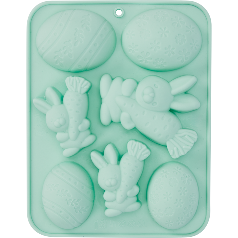 Grüne Silikonform in Form von Karotten und Hasen